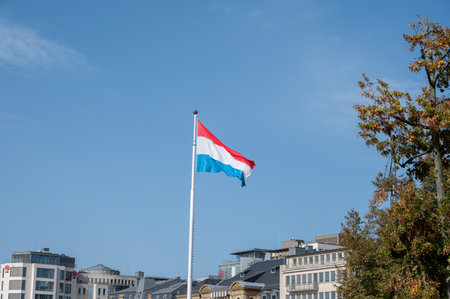 Views of flag of Luxembourg country in Luxembourg or Luxembourg City capital city and one of de facto capitals of European Union in autumnの写真素材