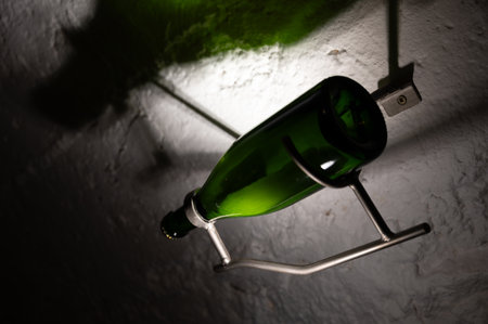 Sediment in bottle. Traditional method of production of cremant sparkling wine in south part of Luxembourg country on bank of Moezel, also known as Mosel, Moselle or Musel river.の写真素材