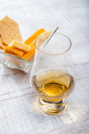 Scotch whiskey and cheese pairing, British cheeses collection, Scottish colored and English matured cheddar cheeses, tasting tour in Englandの写真素材