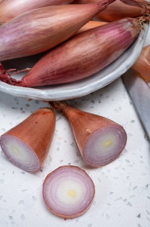 French long pink shallots grappe onion from Brittany, France close upの写真素材