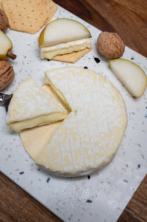 French soft Cremeux de Normandie cheese, soft creamy cheese with white mold close upの写真素材