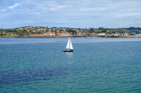 View on promenade, houses and San Lorenzo beach in Gijon, Asturias, Spainの写真素材