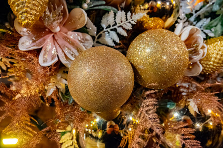 Christmas and New Year street decoration, round Christmas wreath hanging on metal gate, illuminated glass door at night, Epernay in Champagne, Franceの写真素材
