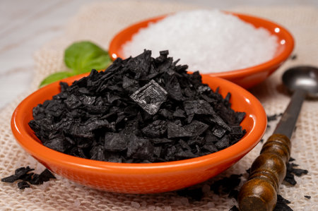 Black and white Mediterranean sea salt close up, Cyprus Black Salt shiny black pyramid-shaped crystals close upの写真素材