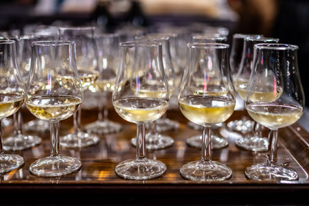 Many small tasting glasses of sparkling champagne wine on winter festival in December, Avenue de Champagne, Epernay, Champagne region, Franceの写真素材