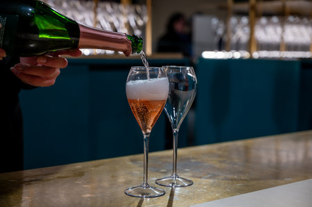 Pouring and tasting of rose sparkling wine champagne on winter weekend festival in December on Avenue de Champagne, Epernay, Champagne region, Franceの写真素材