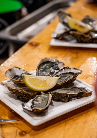 Catch of the day for sale on daily fish market, fresh oysters, Cancale, Brittany, Atlantic ocean, Franceの写真素材