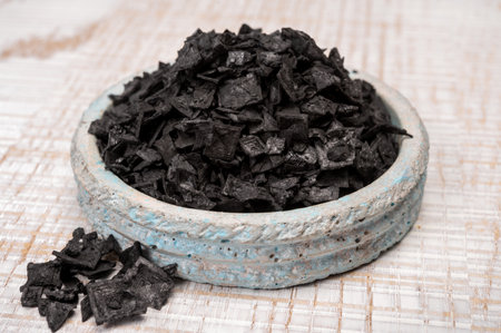 Black sea salt close up, add drama and style to your meals by sprinkling on some Cyprus Black Salt shiny black pyramid-shaped crystal close upの写真素材