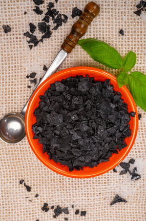 Black sea salt close up, add drama and style to your meals by sprinkling on some Cyprus Black Salt shiny black pyramid-shaped crystal close upの写真素材