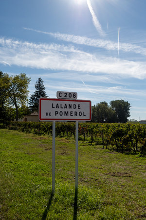 City road sign Lalande de Pomerol near Saint-Emilion wine making region, growing of Merlot or Cabernet Sauvignon red wine grapes, France, Bordeaux in summerの写真素材