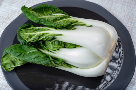 Young organic white bok choy or bak choi Chinese cabbage ready to cook, healing foodの写真素材