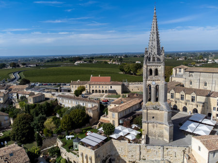 Aerial views of green vineyards, old houses and narrow hilly streets of medieval town St. Emilion, production of red Bordeaux wine on cru class vineyards in Saint-Emilion wine making region, France, Bordeauxの写真素材