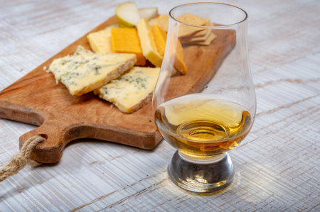 Scotch whiskey and cheese pairing, British cheeses collection, Blue stilton and Scottish colored and English matured cheddar cheeses, tasting tour in Englandの写真素材