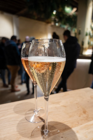 Glass with little bubbles, tasting of sparkling wine champagne on winter festival in December, Avenue de Champagne, Epernay, Champagne region, Franceの写真素材