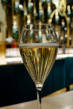 Glass with little bubbles, tasting of sparkling wine champagne on winter festival in December, Avenue de Champagne, Epernay, Champagne region, Franceの写真素材