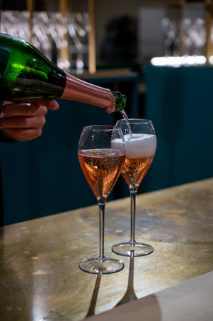 Pouring and tasting of rose sparkling wine champagne on winter weekend festival in December on Avenue de Champagne, Epernay, Champagne region, Franceの写真素材