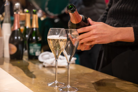Pouring and tasting of dry sparkling wine champagne on winter weekend festival in December on Avenue de Champagne, Epernay, Champagne region, Franceの写真素材