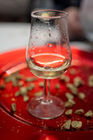 Small tasting glass of sparkling wine champagne on winter festival in December, Avenue de Champagne, Epernay, Champagne region, Franceの写真素材