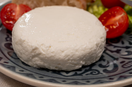 Cheese collection, French fresh white soft goat cheese served with tomatoesの写真素材