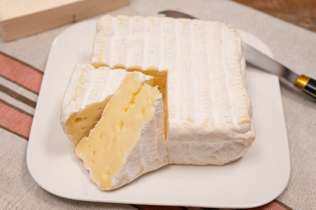French squared pont l'eveque cow cheese from Calvados department, close-up, Pont l'eveque village, Normandy, Franceの写真素材