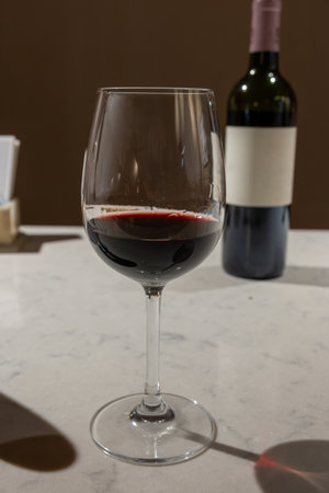 Tasting of red dry Saint-Emilion wine aged in French oak wooden barrels in cellar, Saint-Emilion wine making region, France, Bordeaux made from Merlot, Cabernet Sauvignon red wine grapesの写真素材