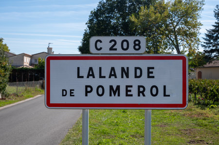 City road sign Lalande de Pomerol near Saint-Emilion wine making region, growing of Merlot or Cabernet Sauvignon red wine grapes, France, Bordeaux in summerの写真素材