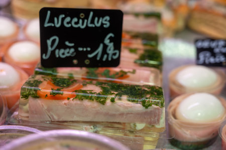 Assortment of meat on weekly food market in France, English translation: cow's tongue in jelly price of 1 pieceの写真素材