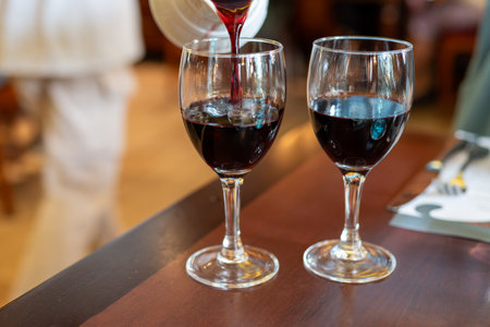 Red dry wine in glasses, lunch with wine in France, old bistro in Limouges, Franceの写真素材