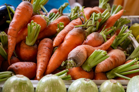Fresh sweet organic orange carrots roots on farmers market on Tenerife, Canary islands, Spain, close...