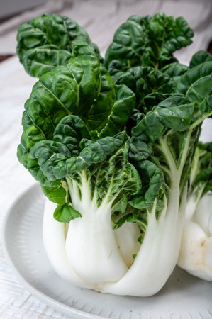 Young organic white bok choy or bak choi Chinese cabbage ready to cook, healing foodの写真素材