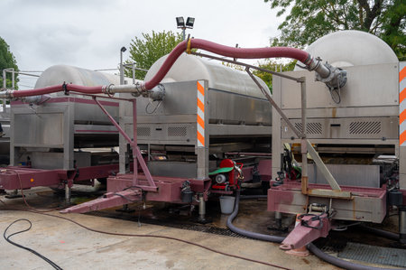 Works at distillery. Harvest time in Cognac white wine region, Charente, crushing and pressing of ugni blanc grape uses for Cognac strong spirits distillation, Grand Champagne, Franceの写真素材