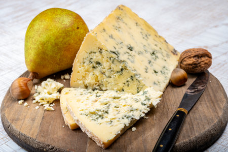 Cheese collection, English cow milk semi-soft, crumbly old stilton blue cheese close upの写真素材