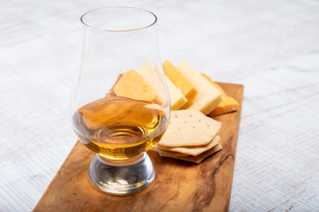Scotch whiskey and cheese pairing, British cheeses collection, Scottish colored and English matured cheddar cheeses, tasting tour in Englandの写真素材