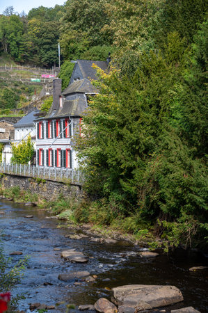 View of houses and streets of old colorful German town Monschau in bend of the river and hidden between the hills, Eifel national park, Germany in summerのeditorial素材