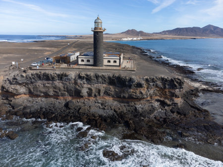 Punta de Jandia and lighthouse on southern end of Fuerteventura island, accessible only by gravel road, sunny winter dayの写真素材