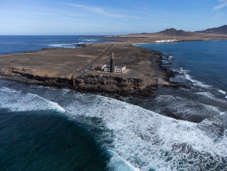 Punta de Jandia and lighthouse on southern end of Fuerteventura island, accessible only by gravel road, sunny winter dayの写真素材