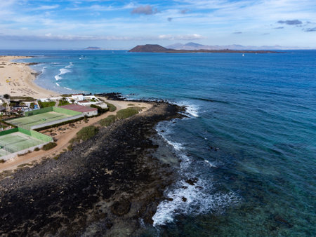 Caleta del bajo, corralejo grandes playas white sandy beaches with blue water near Corralejo touristic town on north of Fuerteventura, Canary islands, Spainの写真素材