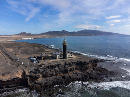 Punta de Jandia and lighthouse on southern end of Fuerteventura island, accessible only by gravel road, sunny winter dayの写真素材