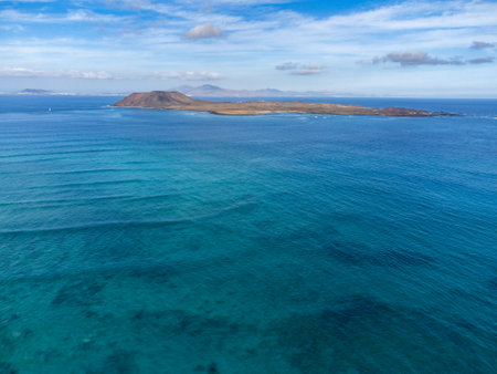Caleta del bajo, corralejo grandes playas white sandy beaches with blue water near Corralejo touristic town on north of Fuerteventura, Canary islands, Spainの写真素材
