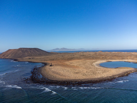 Aerial view Corralejo dunes, white sandy beach, blue water, Lobos and Lanzarote islands, north of Fuerteventura, Canary islands, Spainの写真素材