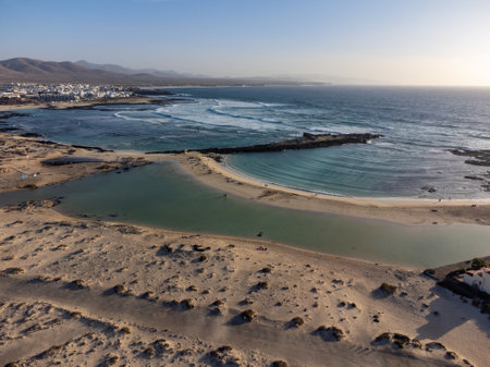 West coast of Fuerteventura island. Winter sea and sun vacation in El Cotillo touristic village, Canary islands, Spain on white sandy beach La Concha.の写真素材