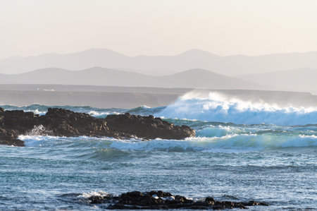 West coast of Fuerteventura island. Winter sea and sun vacation in El Cotillo touristic village, Canary islands, Spain on white sandy beach La Concha.の写真素材