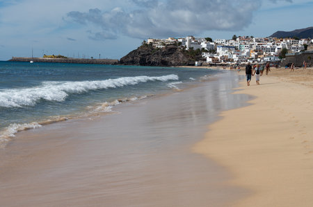 White sandy beach and blue ocean water in Morro Jable vacation village on south of Fuerteventura, Canary islands, Spain in winterのeditorial素材
