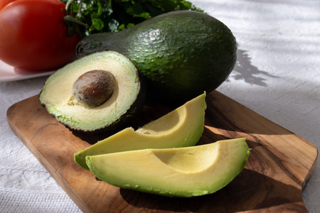 Ripe green organic avocados ready to eat, on table, Fuerteventura, Canary islands, Spainの写真素材