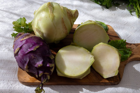 Heads of fresh ripe bio white and purple small cabbage kohlrabi from organic farm, close upの写真素材