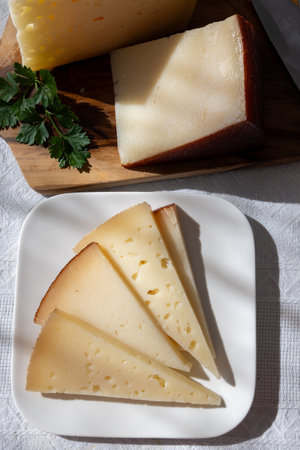 Spanish hard manchego, cow, sheep and goat cheese close upの写真素材
