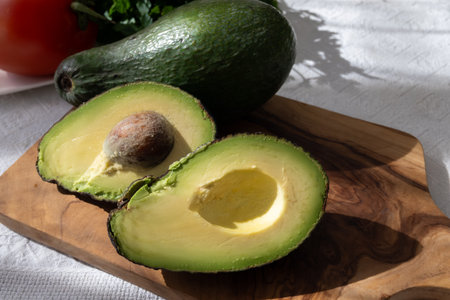 Ripe green organic avocados ready to eat, on table, Fuerteventura, Canary islands, Spainの写真素材