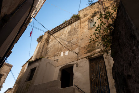 White old houses and narrow streets in medieval small touristic coastal town Sperlonga, Latina, vacation in Italy, winterの写真素材