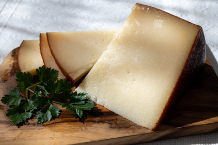 Spanish hard manchego, cow, sheep and goat cheese close upの写真素材