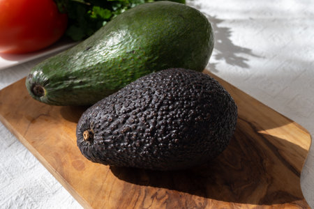 Ripe green organic avocados ready to eat, on table, Fuerteventura, Canary islands, Spainの写真素材